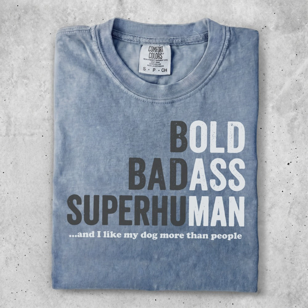 Blue Comfort Colors t-shirt with "BOLD BADASS SUPERHUMAN...and I like my dog more than people" text.