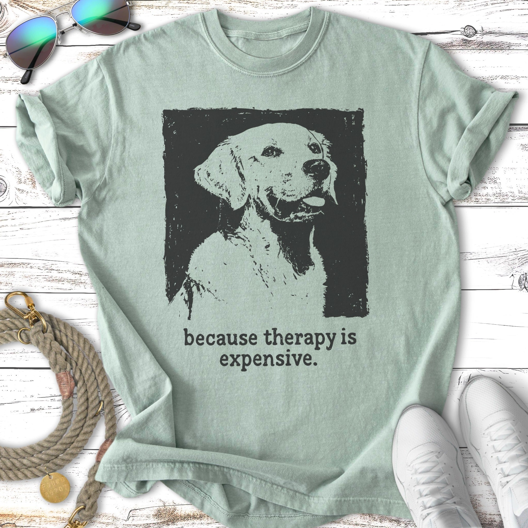 Light green t-shirt with a black graphic of a golden retriever and text.