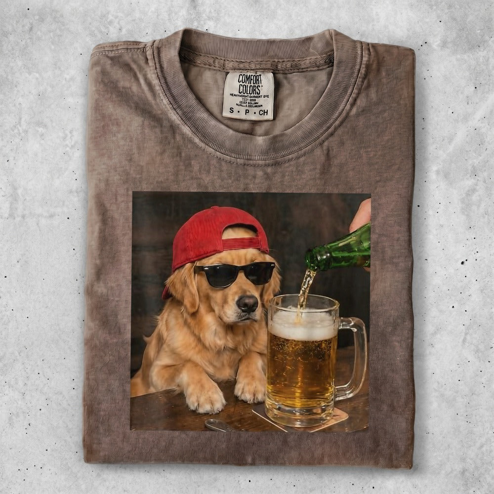 Golden retriever in sunglasses and red hat pours beer into a mug.