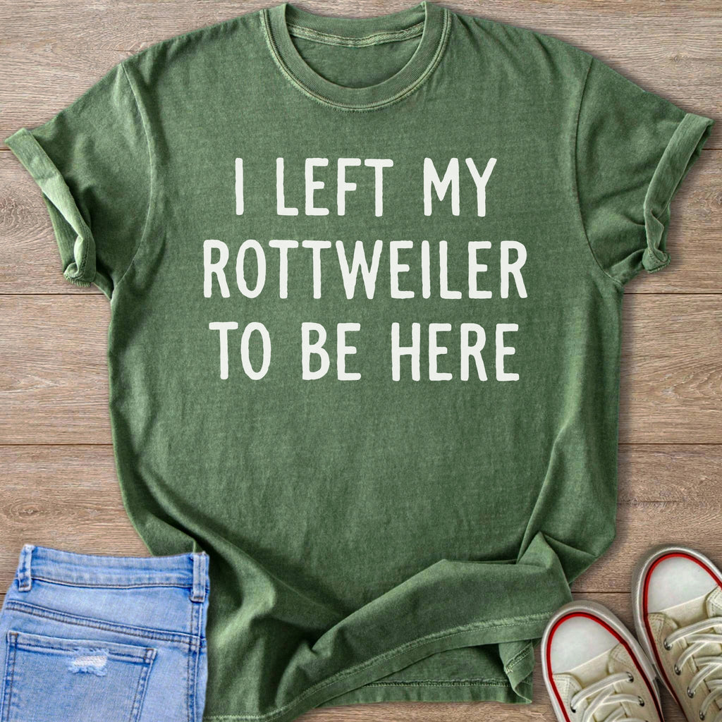 Green t-shirt with white text "I LEFT MY ROTTWEILER TO BE HERE".