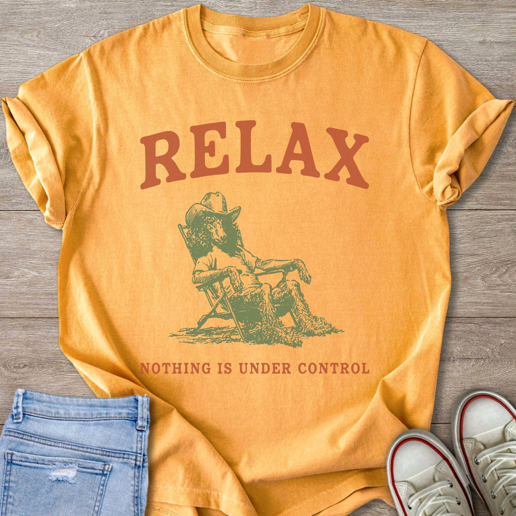 Orange t-shirt with text RELAX and a drawing of a dog in a cowboy hat.