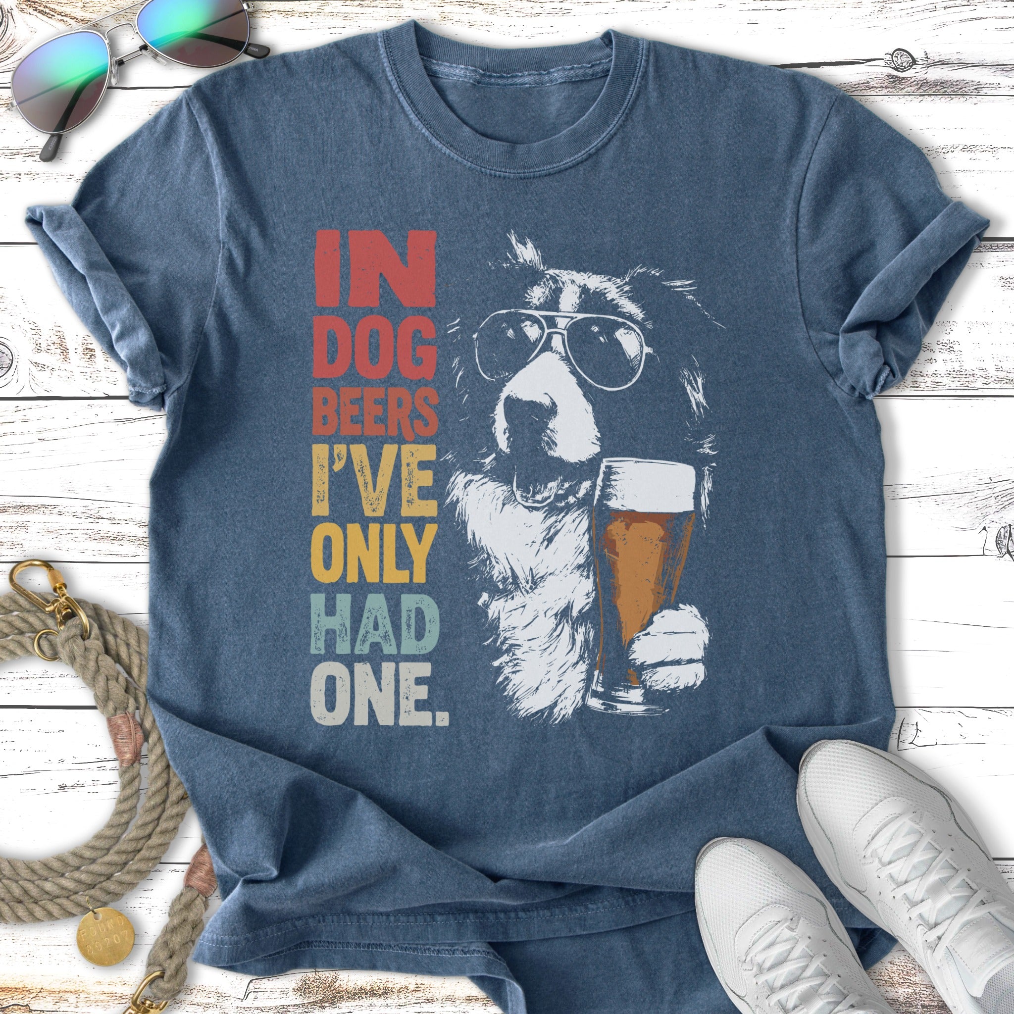 Dog wearing sunglasses holding beer mug, "In Dog Beers I've Only Had One" text.