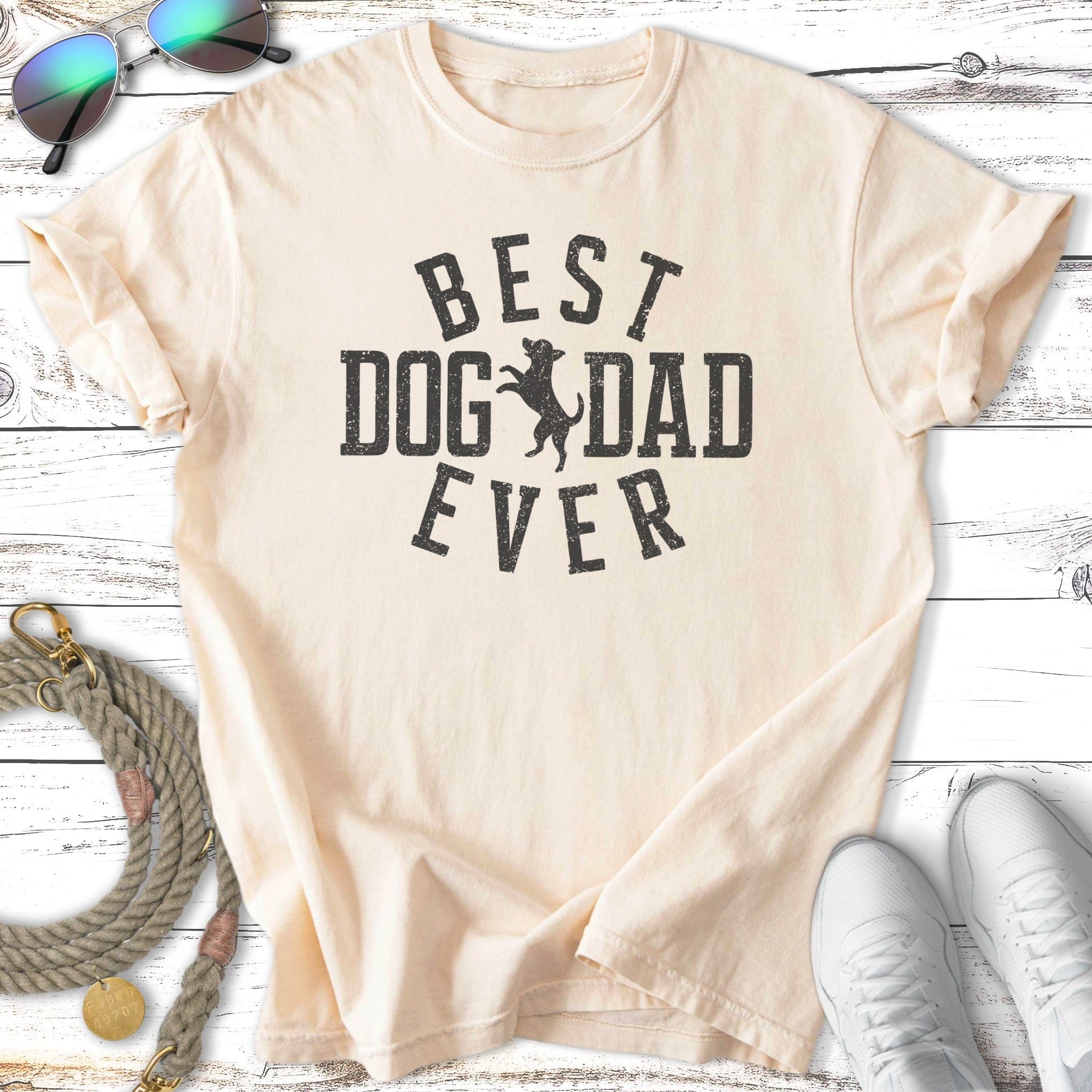 Cream t-shirt with "BEST DOG DAD EVER" printed in black text and a dog silhouette.