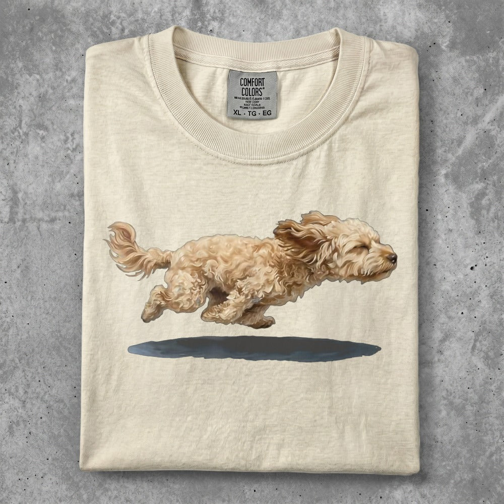 T-shirt with a tan doodle dog running mid-air.