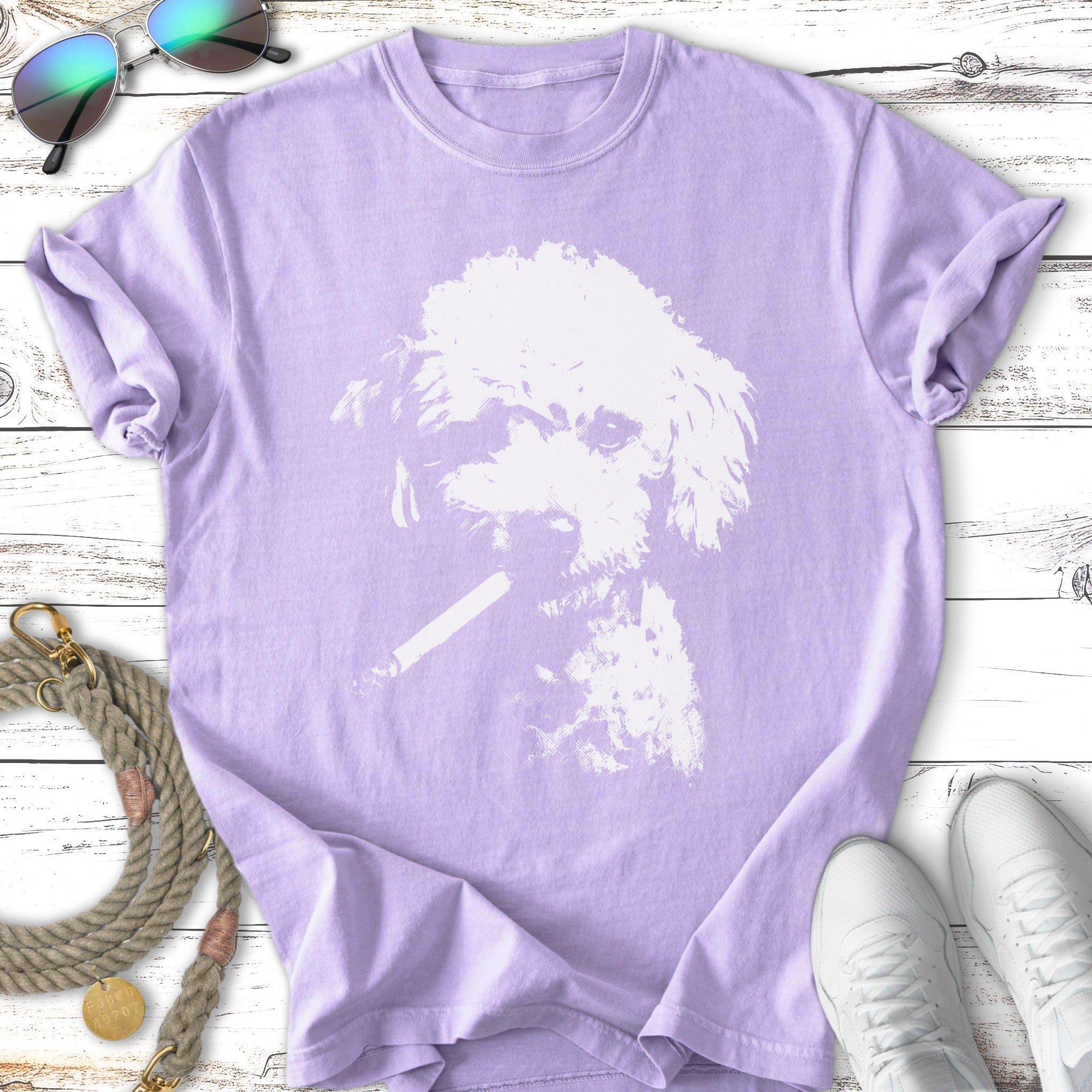 Light purple t-shirt with a white graphic of a dog wearing sunglasses and smoking a cigarette.