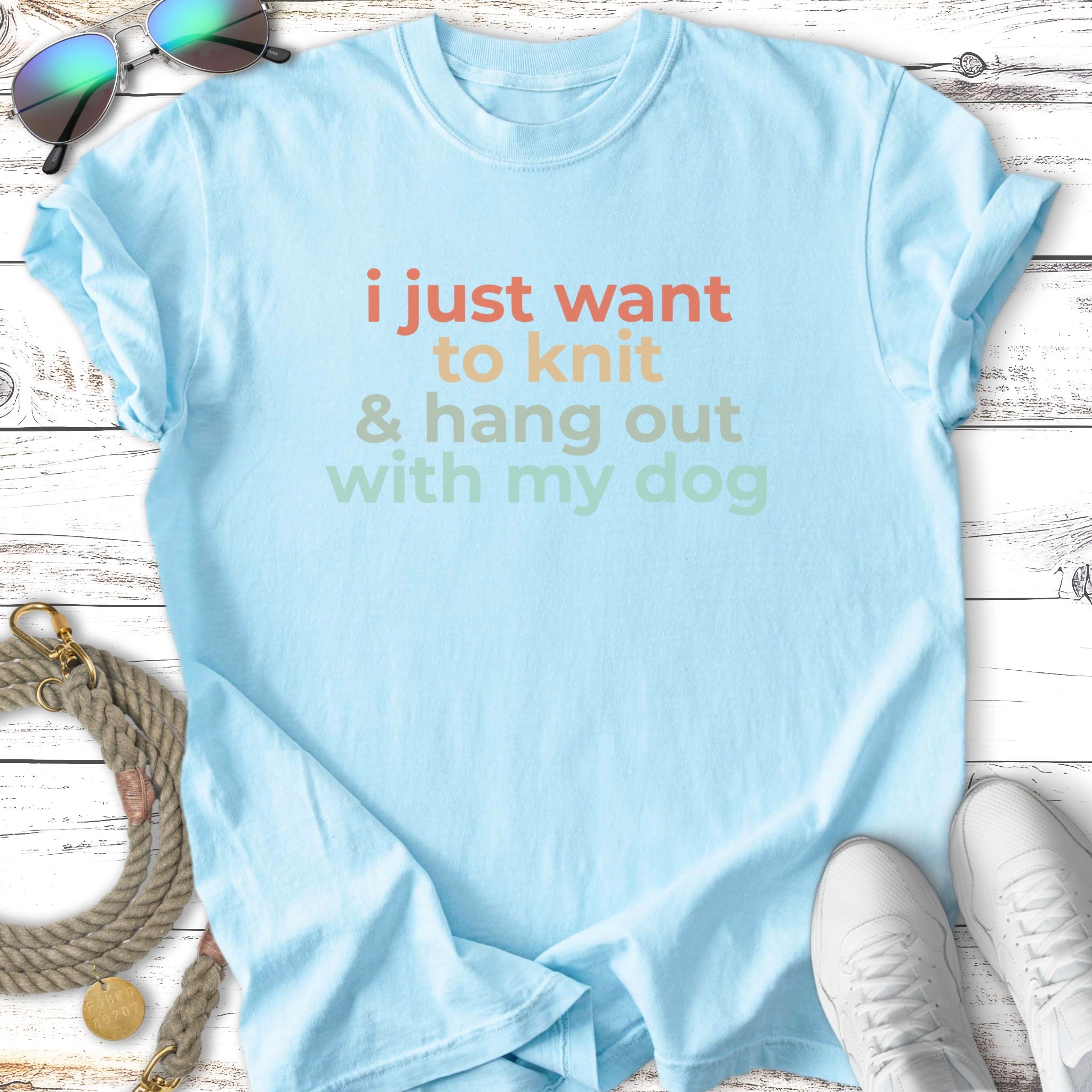 Light blue t-shirt with "i just want to knit & hang out with my dog" text.