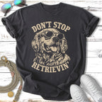 Dark t-shirt with "Don't Stop Retrieving" text and a Golden Retriever wearing sunglasses.