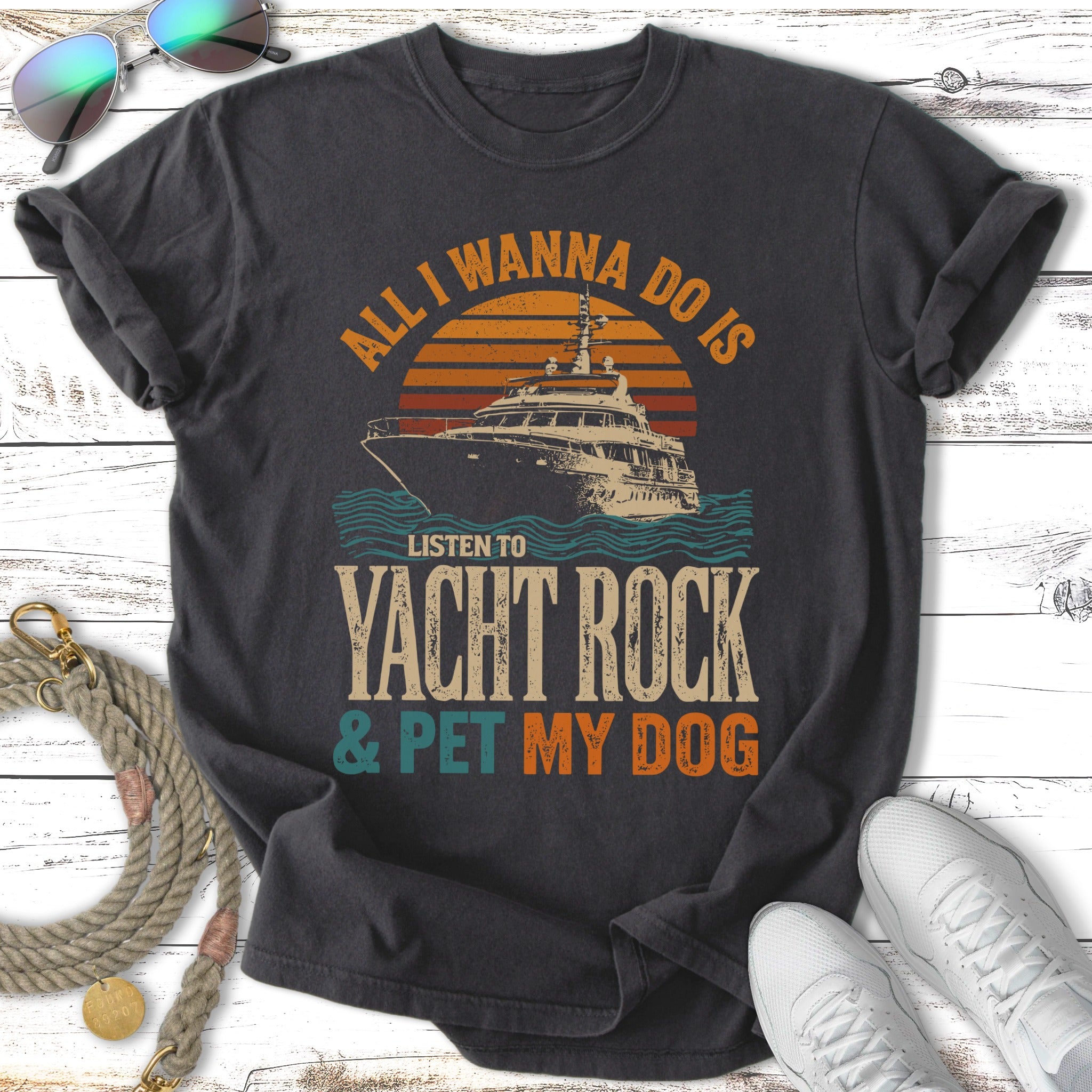 T-shirt with "All I Wanna Do Is Listen To Yacht Rock & Pet My Dog" text and yacht graphic.