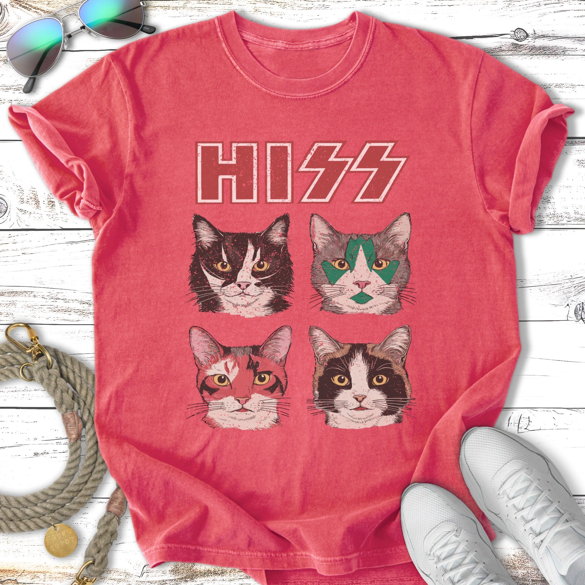 Four cats with distinct markings and eye makeup on a distressed red t-shirt.