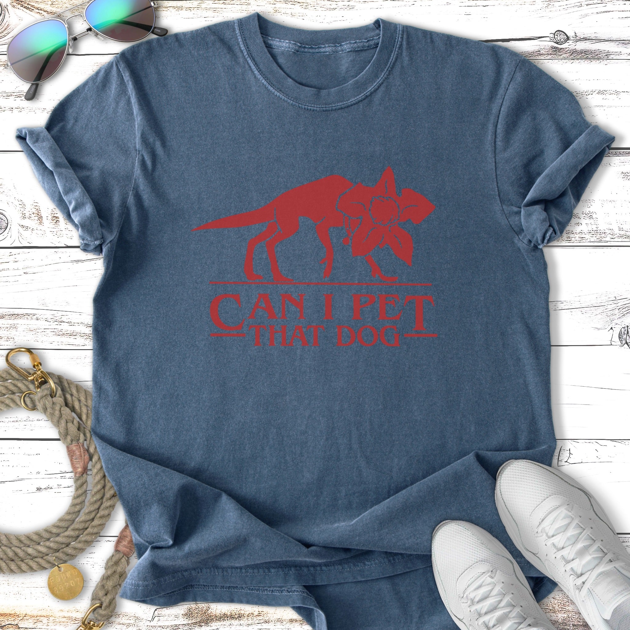 Blue t-shirt with a red graphic of the Demogorgon and "CAN I PET THAT DOG".