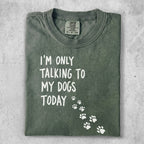Olive green t-shirt with "I'm only talking to my dogs today" and paw prints.