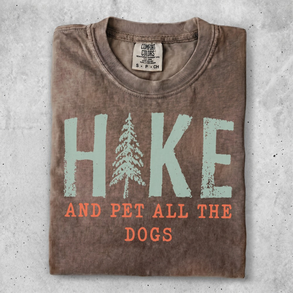 Brown t-shirt with "HIKE AND PET ALL THE DOGS" in teal and orange.