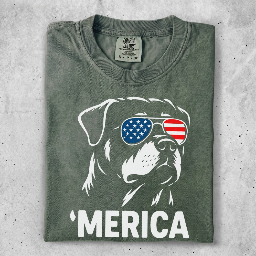 Rottweiler wearing American flag sunglasses, text reads 'MERICA.