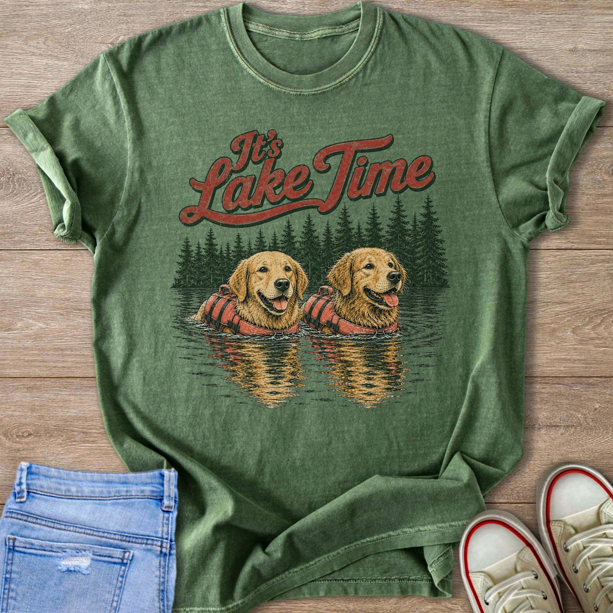 Green t-shirt graphic with two golden retrievers in life vests and "It's Lake Time" text.