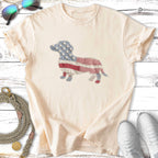Cream t-shirt with a dachshund graphic made of American flag fabric.