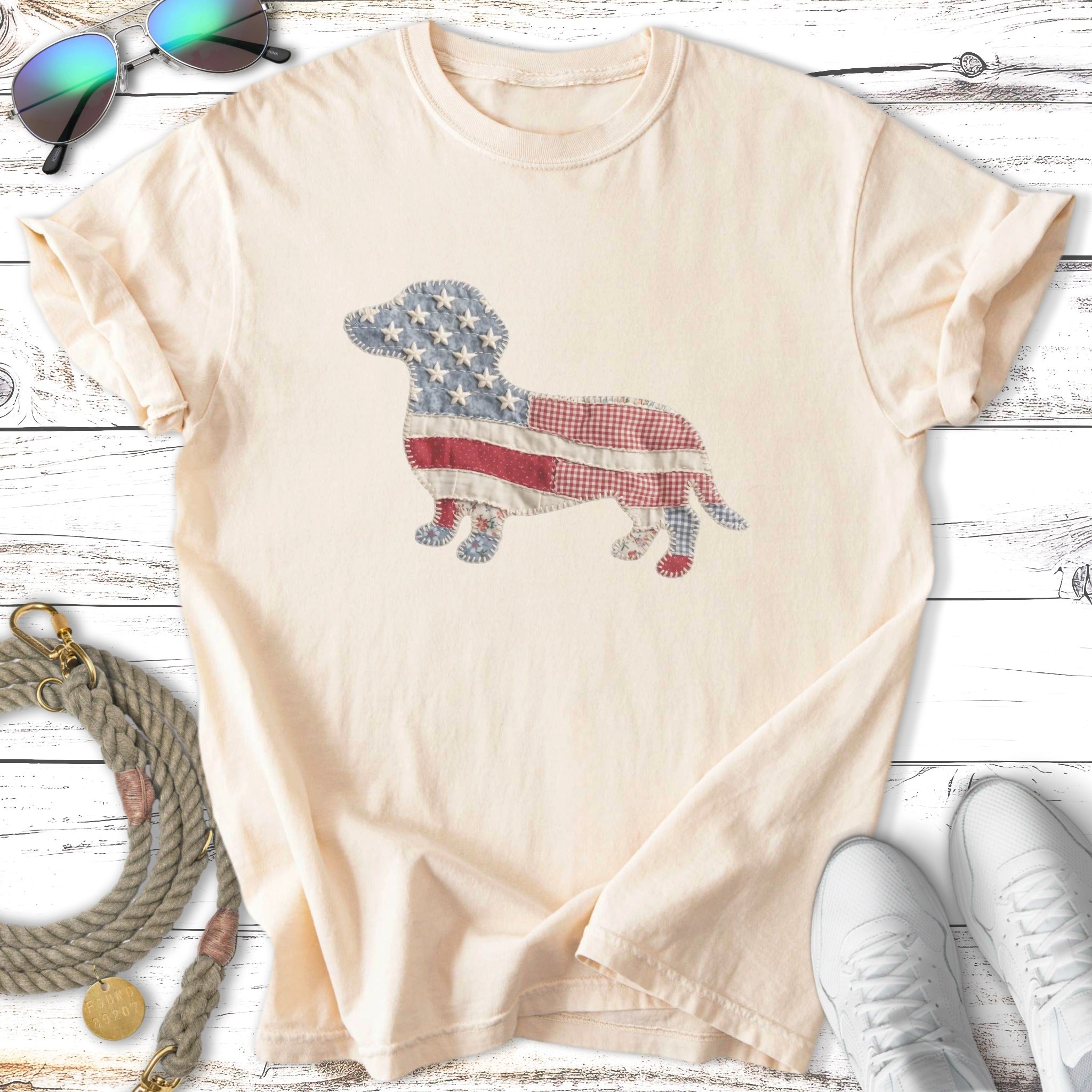 Cream t-shirt with a dachshund graphic made of American flag fabric.