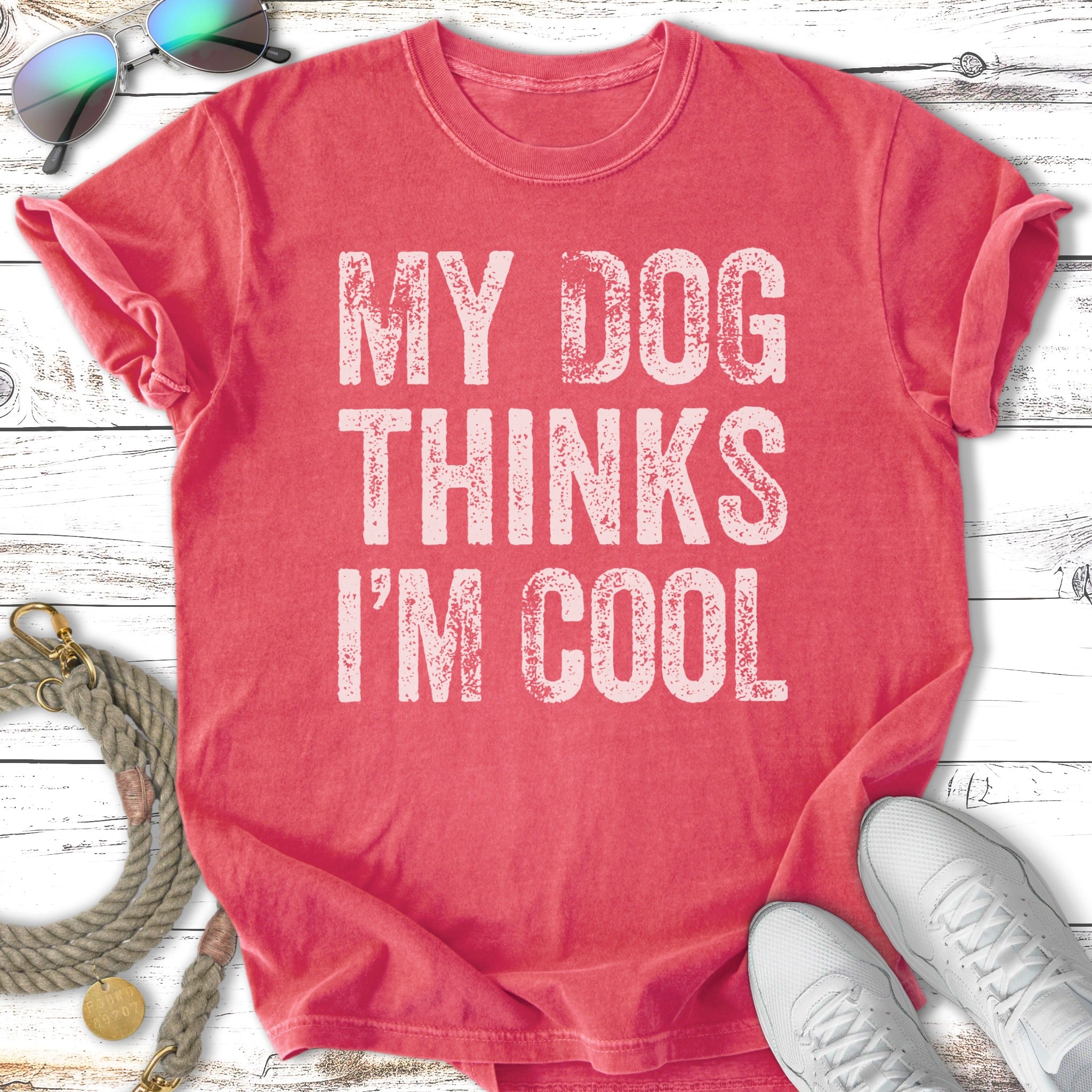 Coral t-shirt with "My Dog Thinks I'm Cool" graphic.