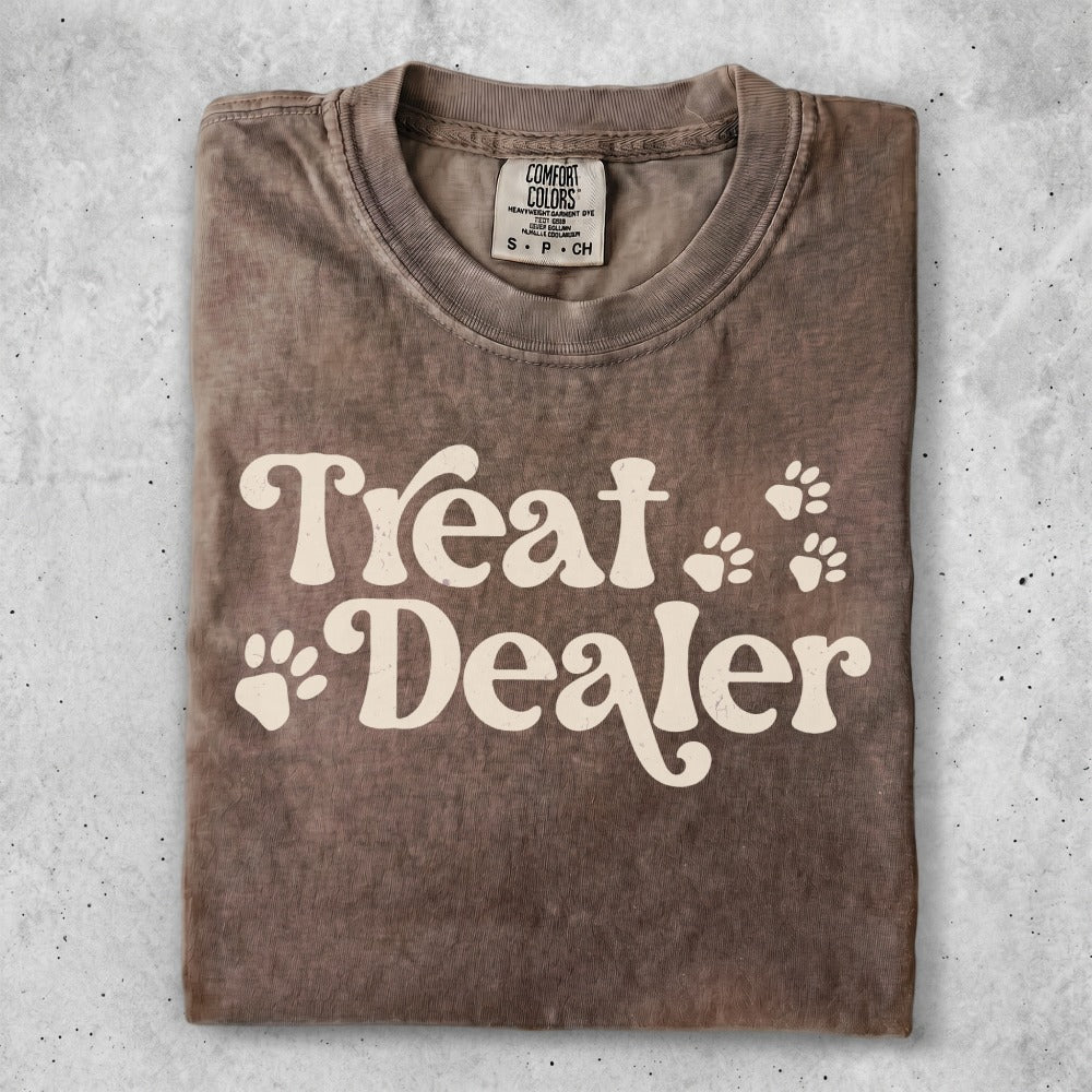 Brown t-shirt with "Treat Dealer" and paw print graphics.