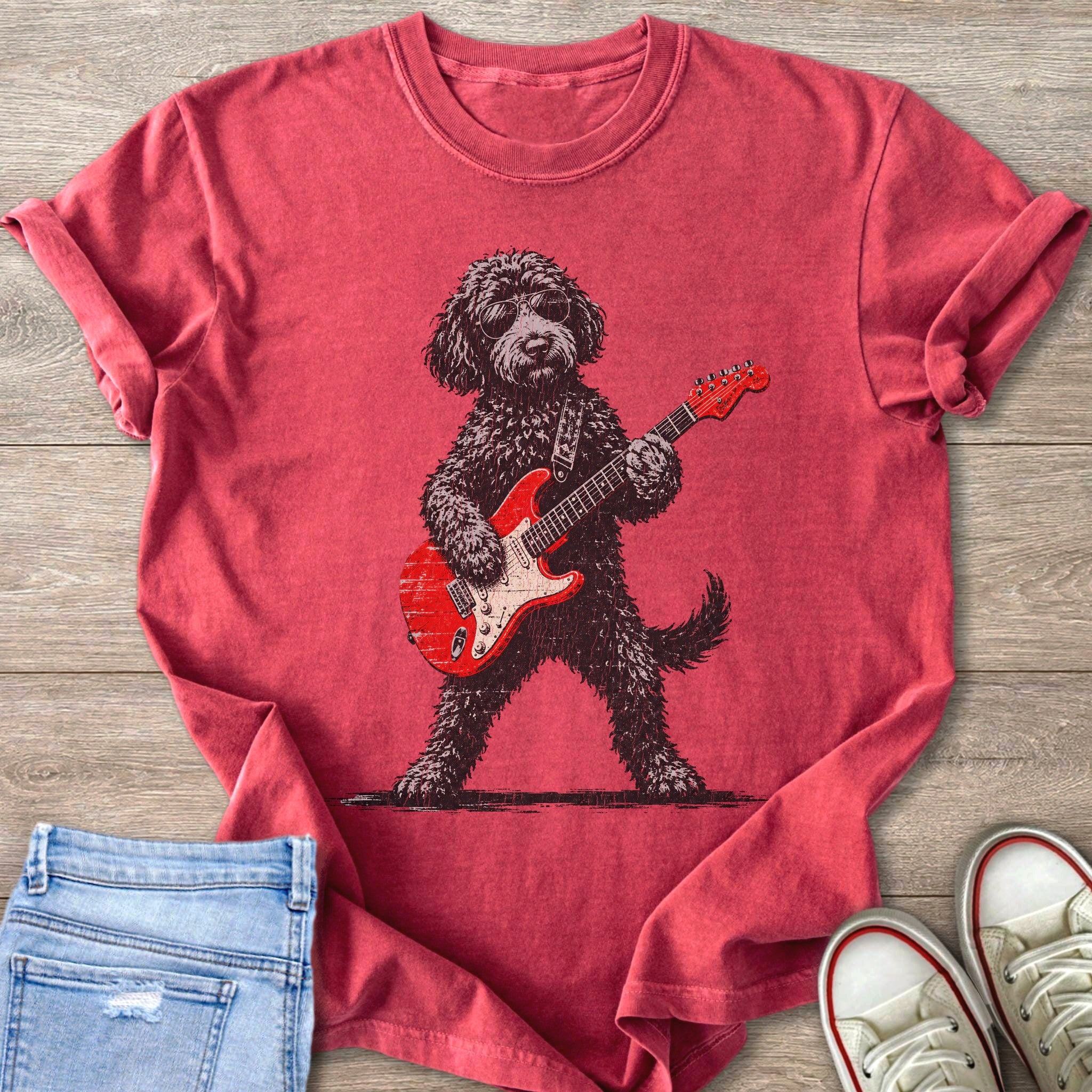 Red t-shirt with distressed print of a poodle playing a red electric guitar.