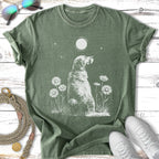 Golden retriever seated among daisies under a full moon.