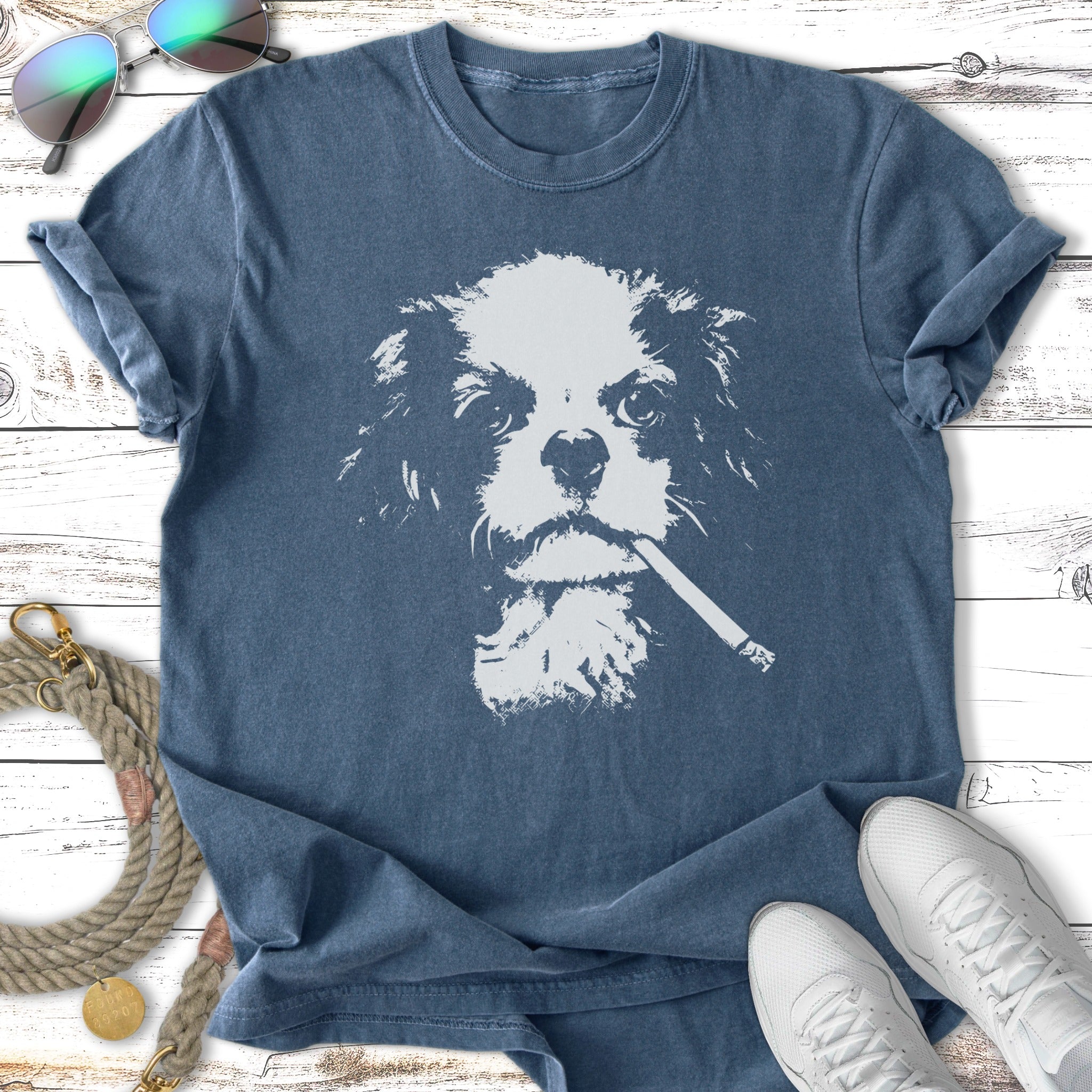 T-shirt featuring a stylized white dog face with a cigarette in its mouth.