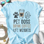 Light blue t-shirt with "Pet Dogs Drink Coffee Lift Weights" text and graphics.