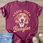 Maroon t-shirt with a beagle graphic and the text "SAVE THE Beagles".
