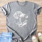 Dachshund dog graphic on grey t-shirt blowing on dandelions