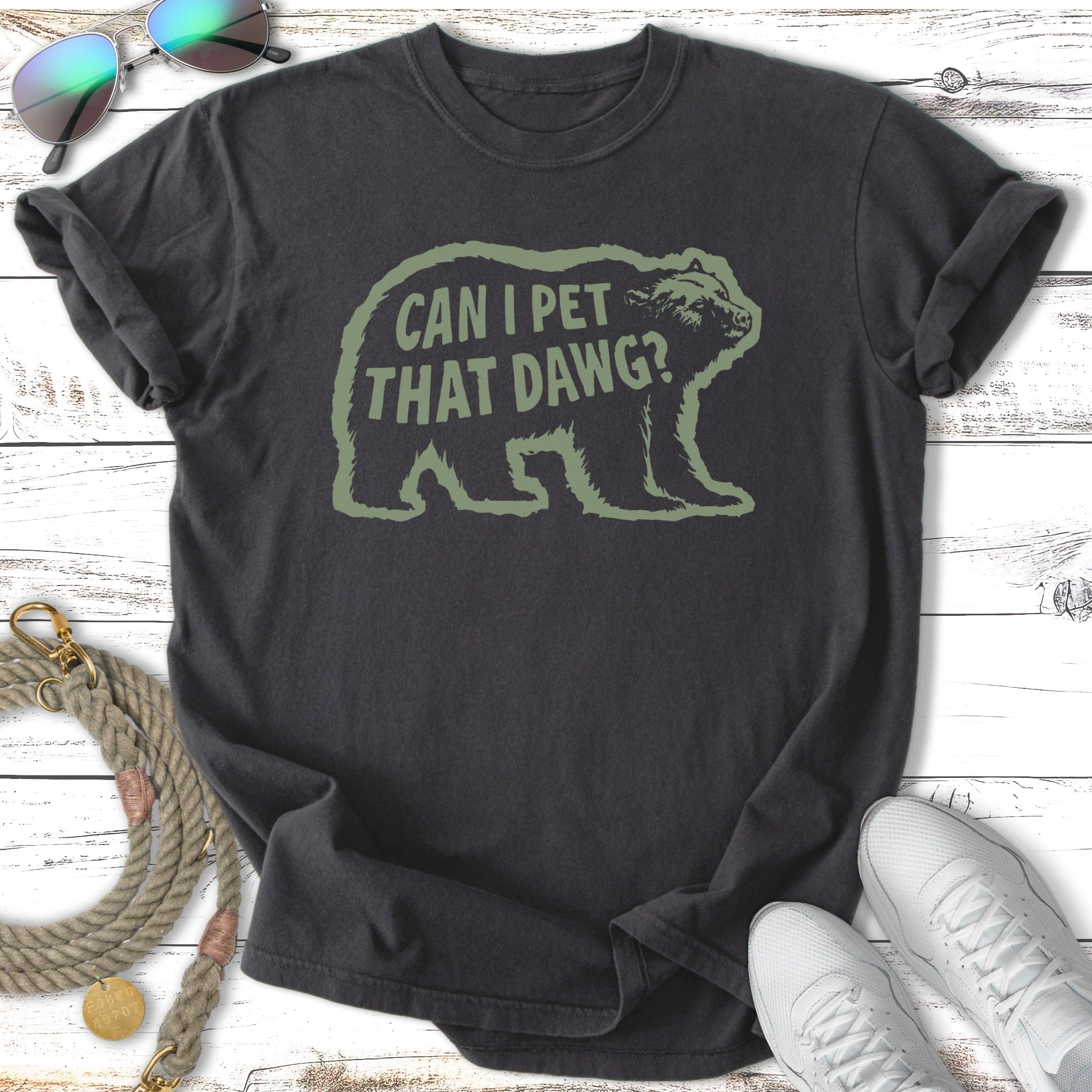Dark t-shirt with green text "CAN I PET THAT DAWG?" and bear graphic.