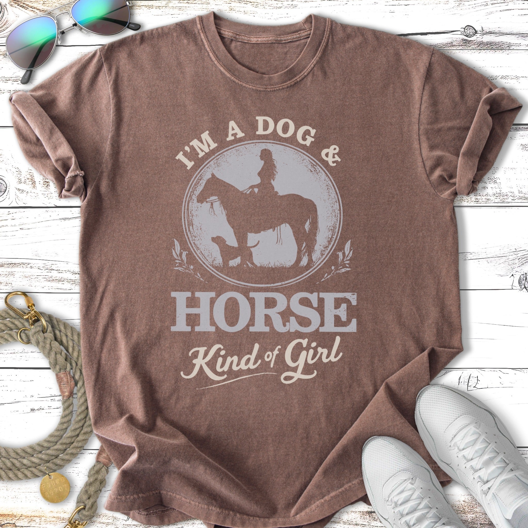 Brown t-shirt with "I'm a Dog & Horse Kind of Girl" graphic and equestrian scene.