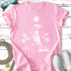 Pink t-shirt with a white line drawing of a dog sitting among daisies.