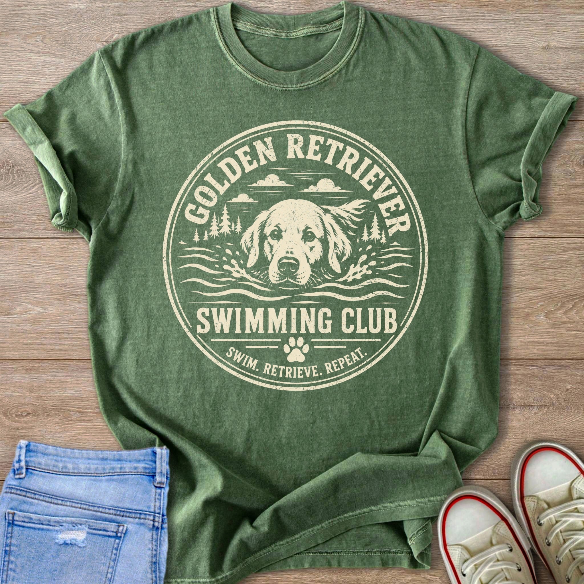 Green t-shirt with a circular graphic of a Golden Retriever swimming, saying "Golden Retriever Swimming Club."