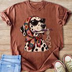 Dalmatian wearing sunglasses and crochet headscarf holding crochet hook and yarn.