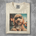 Dog wearing sunglasses drinks from a cup with a straw.