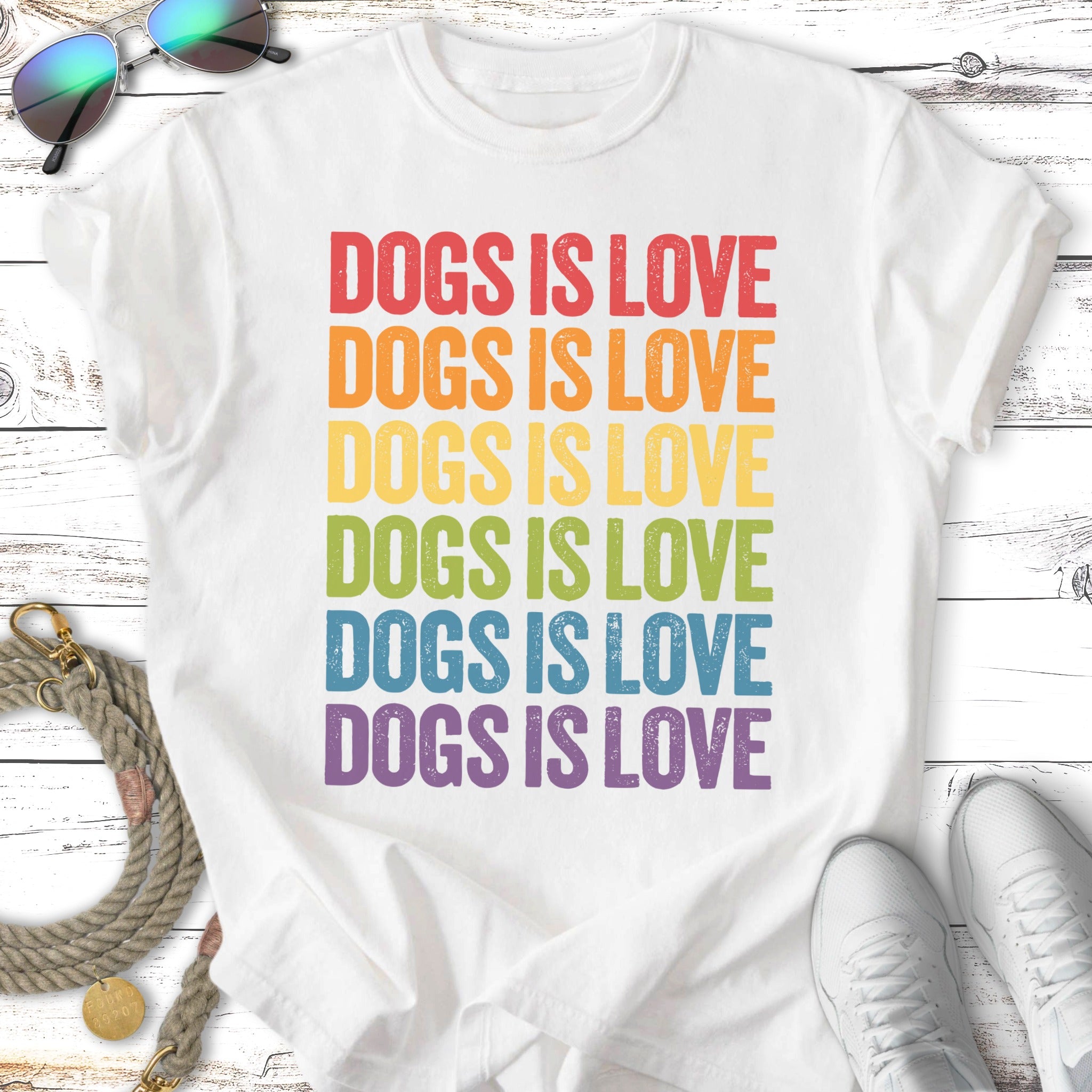 White t-shirt with "Dogs is Love" in rainbow text.