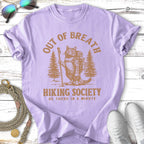 Cat hiker with backpack and walking stick in forest with "Out of Breath Hiking Society" text.