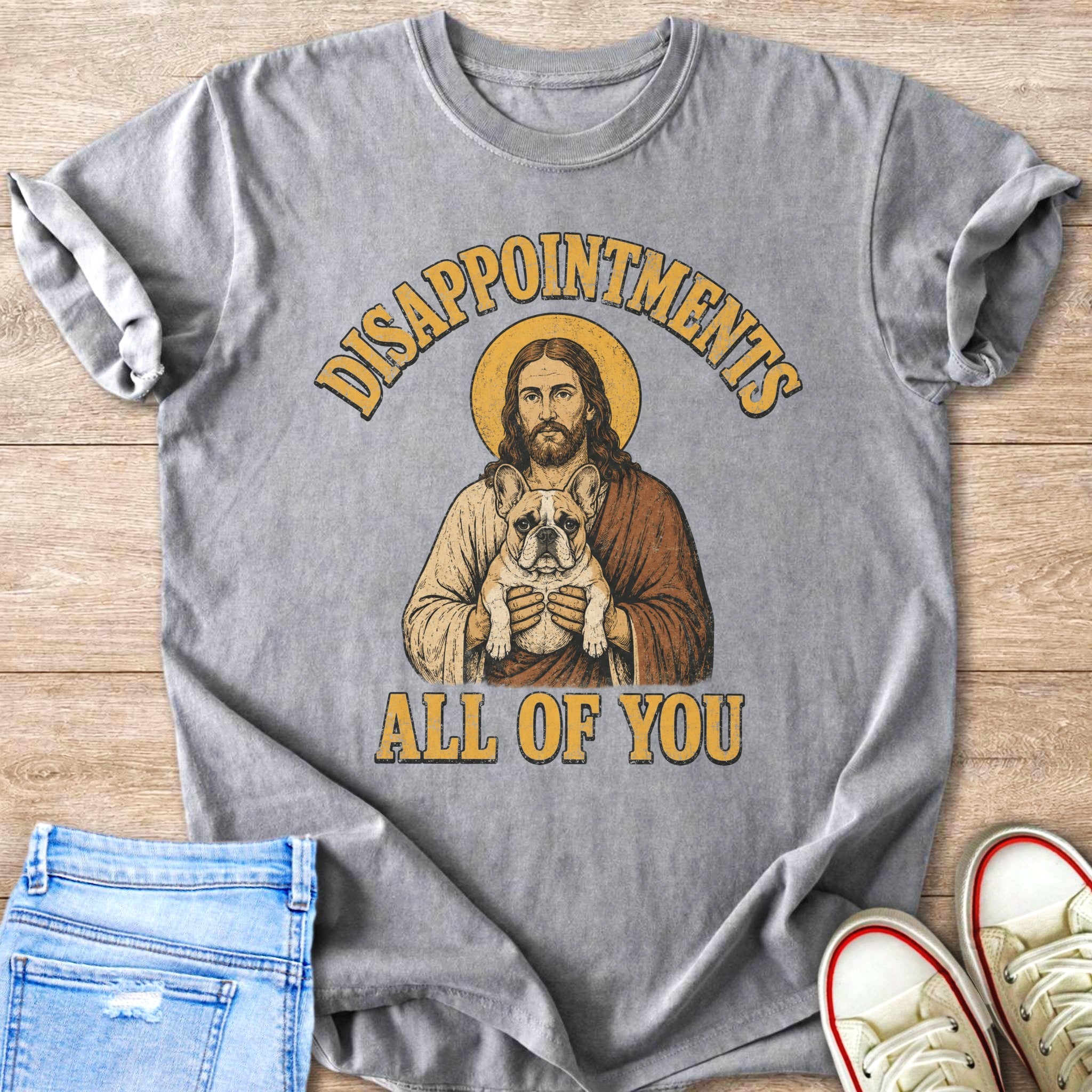 Jesus holding a French bulldog with "Disappointments All of You" text.