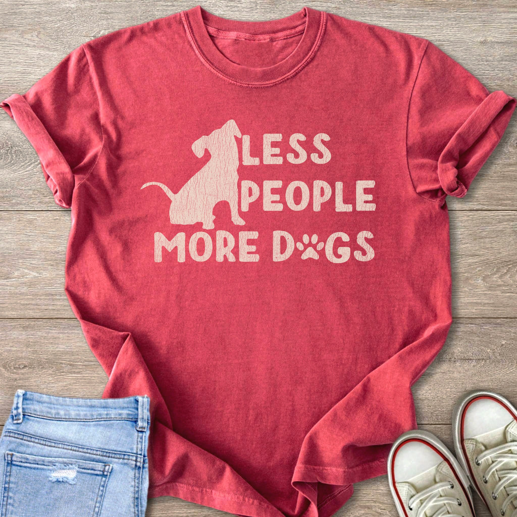 Red t-shirt with faded white graphic of a dog silhouette and text "LESS PEOPLE MORE DOGS".