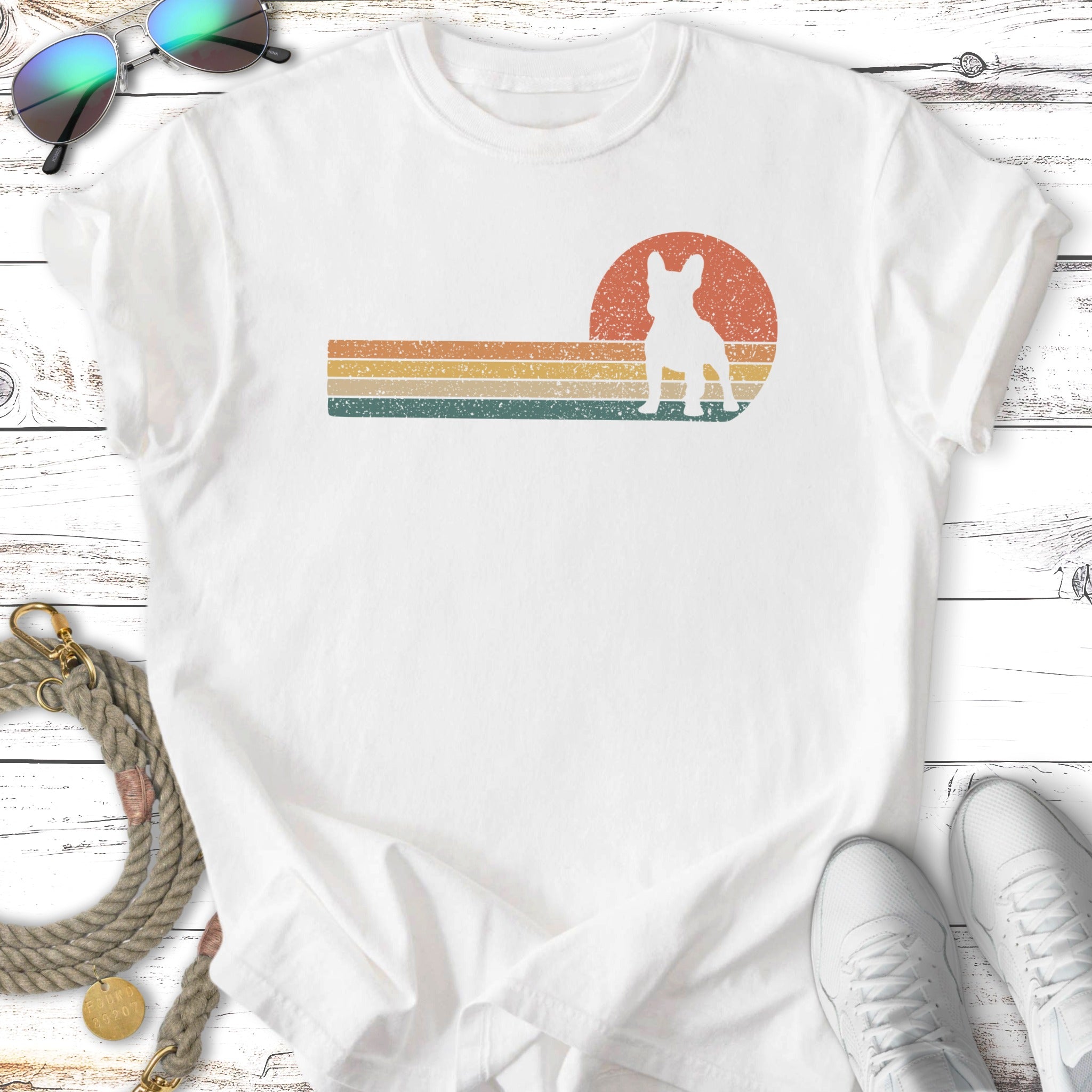 Retro French Bulldog silhouette against striped sunset on white t-shirt.