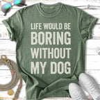 Green t-shirt with "Life would be boring without my dog" text.