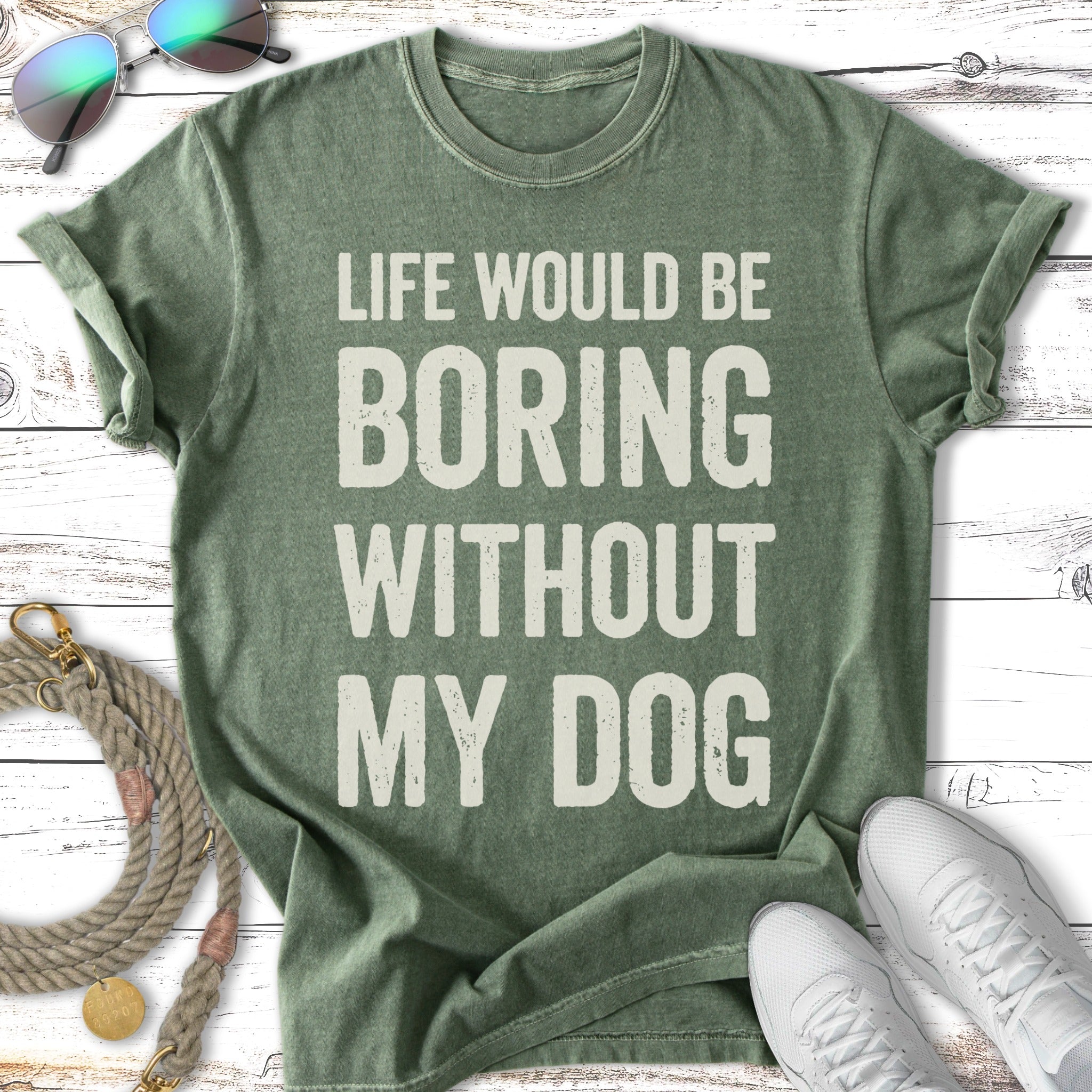 Green t-shirt with "Life would be boring without my dog" text.