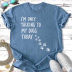 Blue t-shirt with "I'm only talking to my dogs today" text and paw prints.