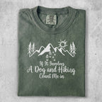 Green t-shirt with mountains, trees, sun, and text "If It Involves A Dog and Hiking Count me In".