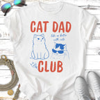 White t-shirt with "CAT DAD CLUB" and cartoon cats.