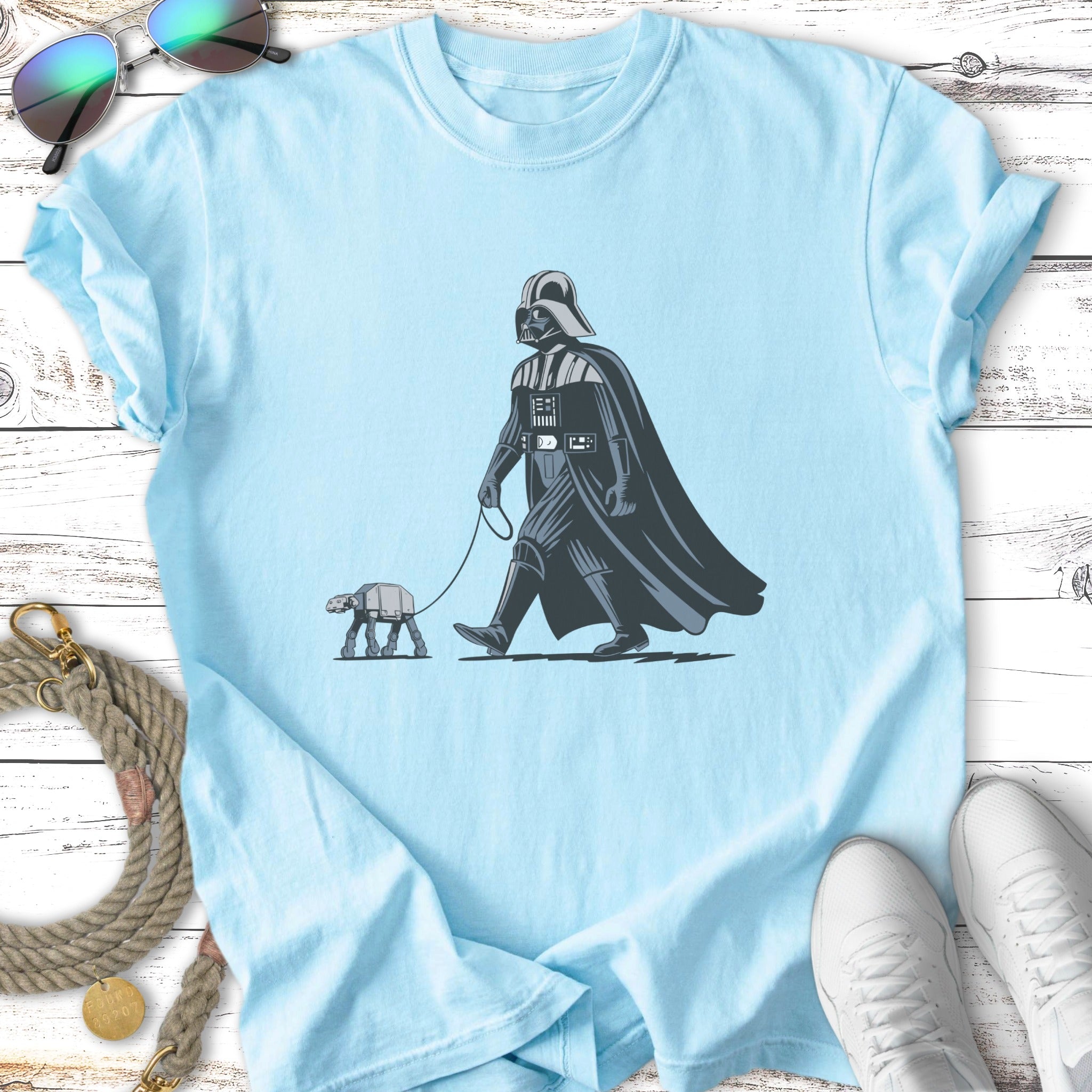 Darth Vader walks a small AT-ST walker on a leash.