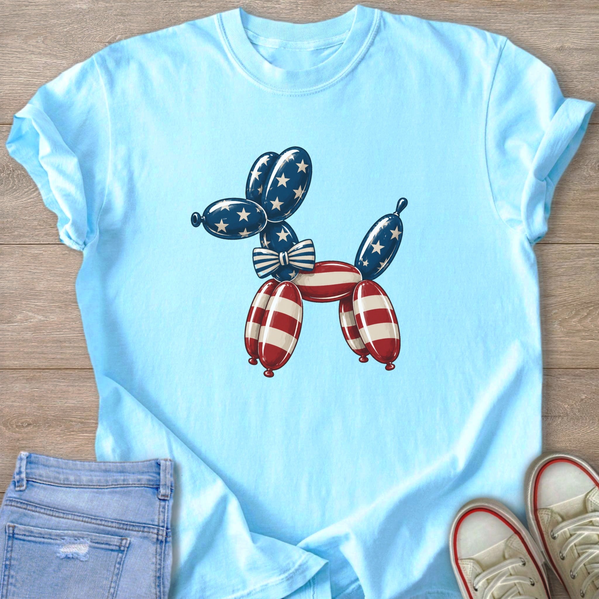 Light blue t-shirt with a balloon dog graphic in American flag colors.