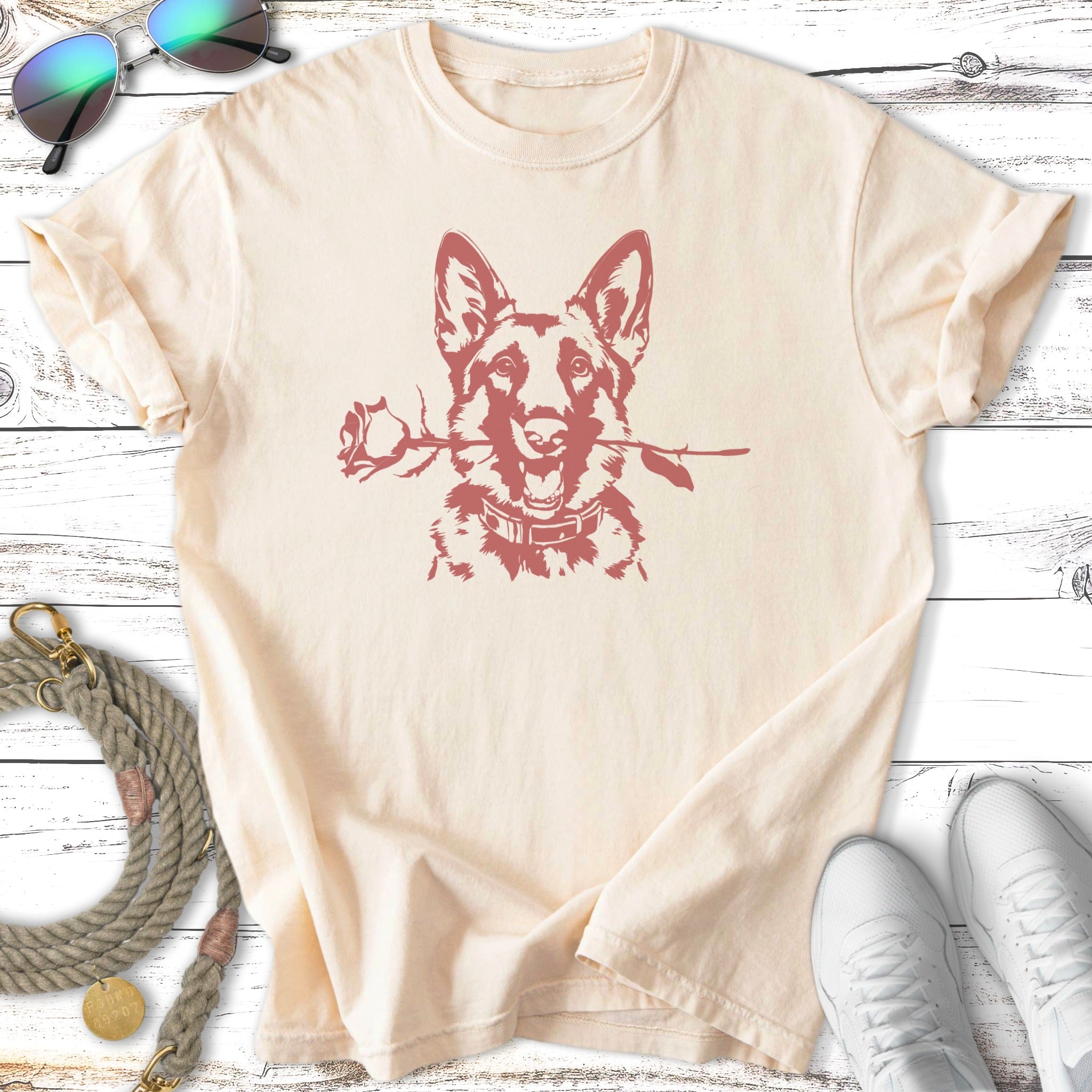 Cream t-shirt with a German Shepherd holding a rose in its mouth.