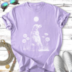 White line art of a golden retriever sitting among daisies under a moon.