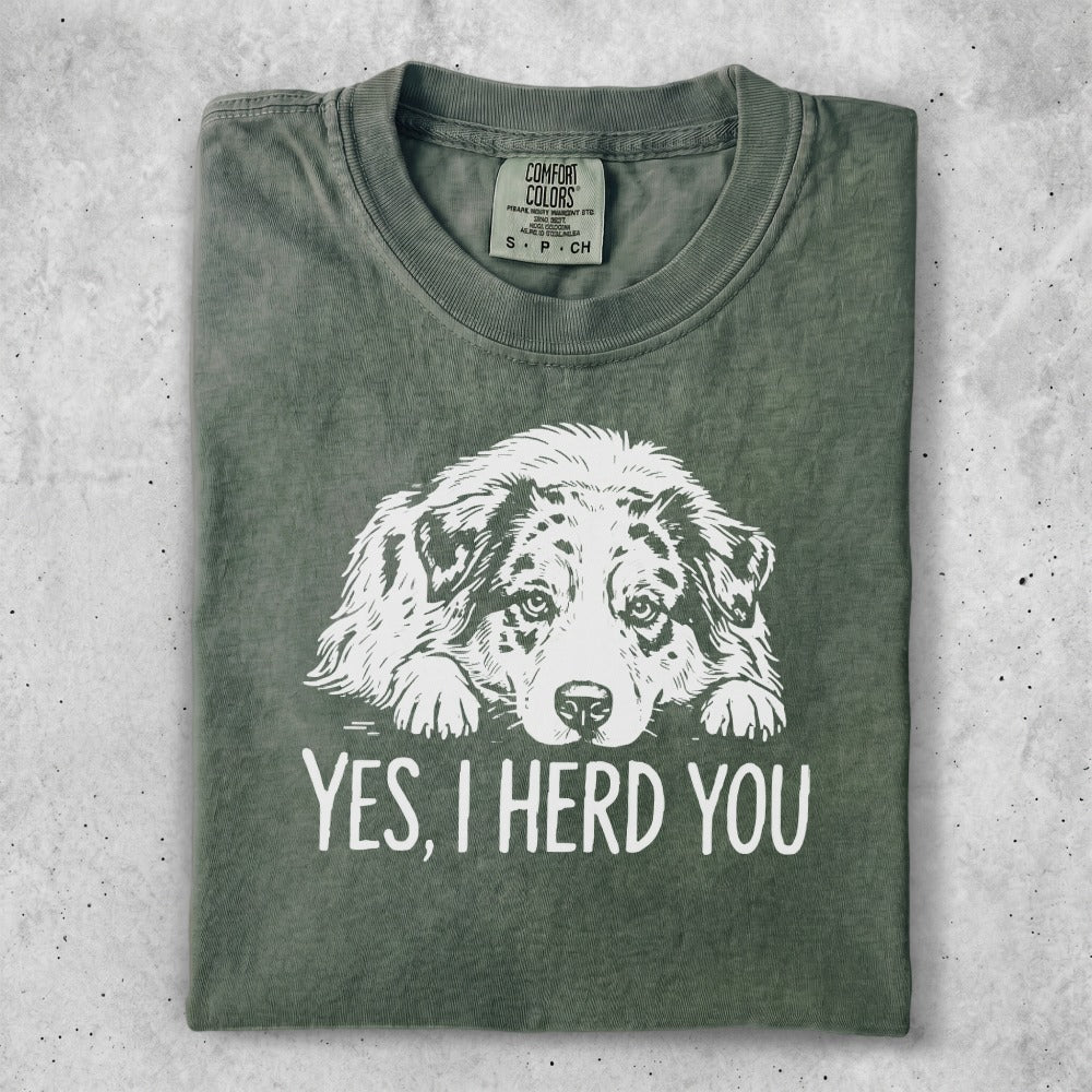 Green t-shirt with "YES, I HERD YOU" and a dog graphic.