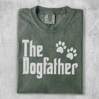 Green t-shirt with "The Dogfather" text and paw prints.